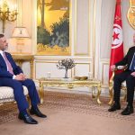 Deputy Prime Minister and Minister of Planning Dr. Mohammed Ali Tamim hands Tunisian President Kais Saied an official invitation to attend the Arab Summit in Baghdad